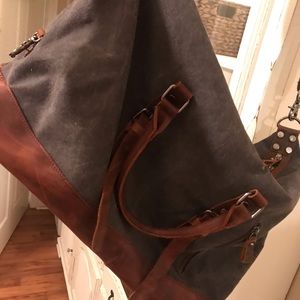 Large denim and leather duffel bag